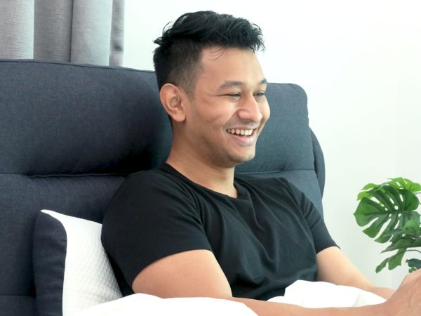 Man Laughing In Bed